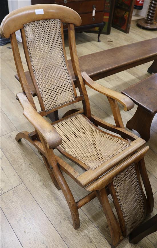 A cane backed steamer chair